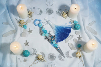 Decorative Athame with blue tassel and beads with crystals and candles 